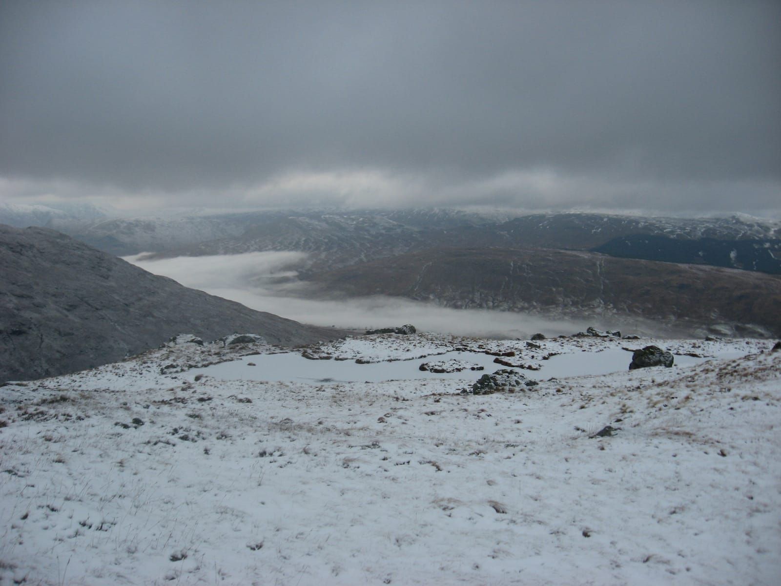 Grey and atmospheric evening descent from Cruach Ardrain