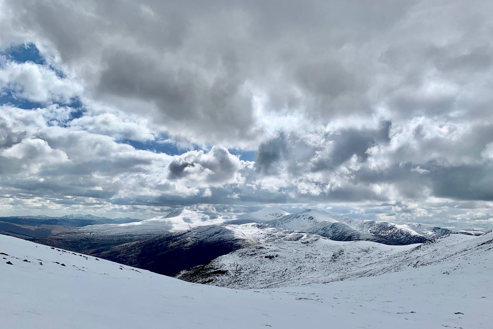 Snow-capped summits of the Ben Lawers range seen from the Glen Lyon horseshoe