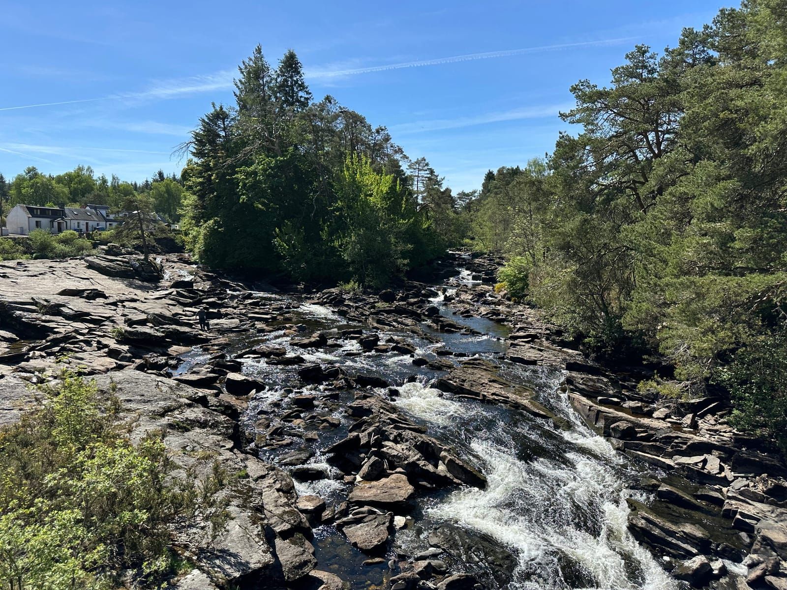Rushing water cascading over rocks at the Falls of Dochart